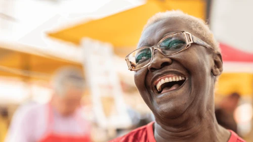 Elderly woman laughing and smiling outside