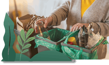 A woman sorting through recyclables by placing them in different containers