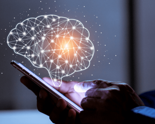 Illustration of a human brain above a hand.
