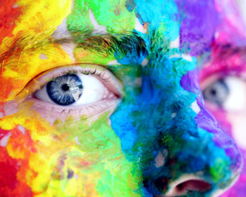 Rainbow paitined face of a young person