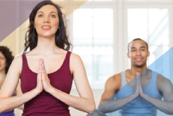 Yoga instructor with students in a class.