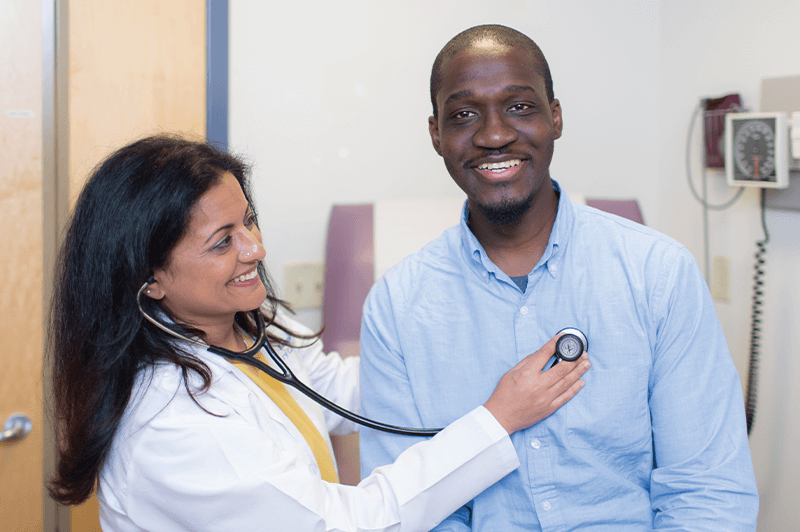 Dr. Yamini and a patient in the exam room