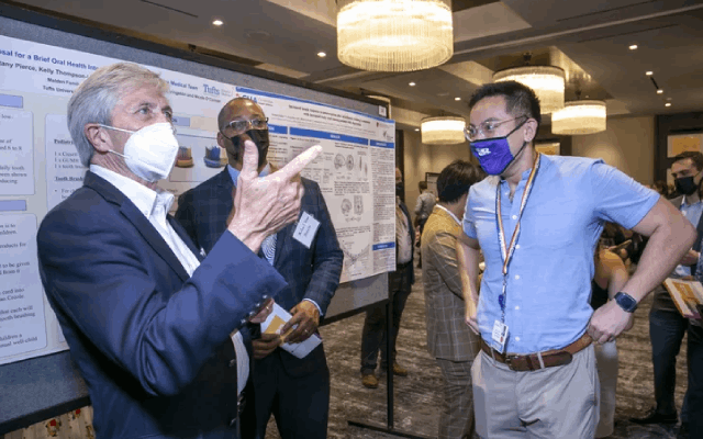 OAA Faculty attending recent poster session