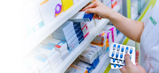Pharmacist hands stocking medications
